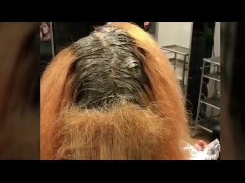 بالفيديو رجل مذهل يضع المكياج ويكوي شعره مثل النساء