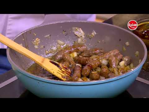 بالفيديو  طريقة إعداد صينية بطاطس بالسجق والثوم
